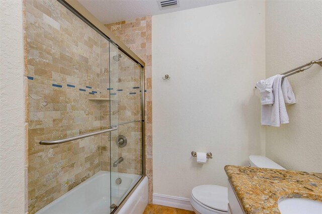 112 Palm Ave, Anna Maria, FL 34216 - full bathroom featuring toilet, enclosed tub / shower combo, vanity, and baseboards