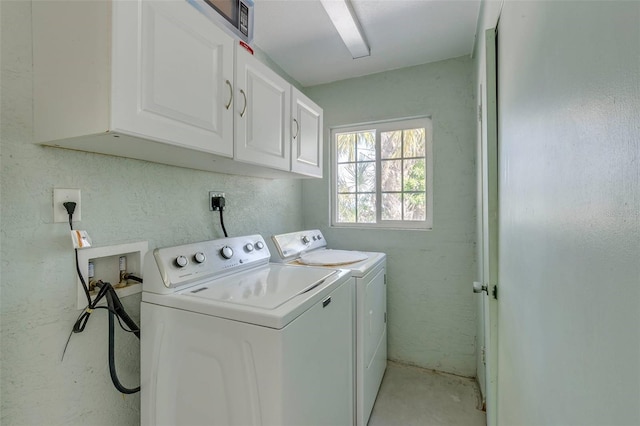 112 Palm Ave, Anna Maria, FL 34216 - washroom featuring cabinet space and washer and clothes dryer