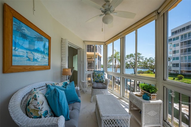 1350 N Portofino Dr Unit 208, Sarasota, FL 34242 - sunroom with plenty of natural light, a water view, and a ceiling fan