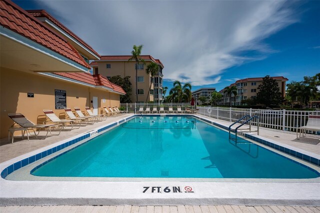 1350 N Portofino Dr Unit 208, Sarasota, FL 34242 - community pool featuring fence and a patio area