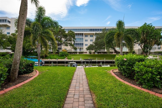 1350 N Portofino Dr Unit 208, Sarasota, FL 34242 - view of property's community with a dock, a yard, and boat lift