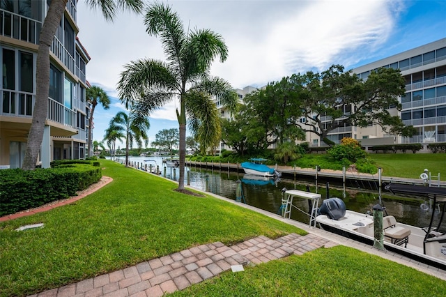 1350 N Portofino Dr Unit 208, Sarasota, FL 34242 - dock area featuring a water view and a yard