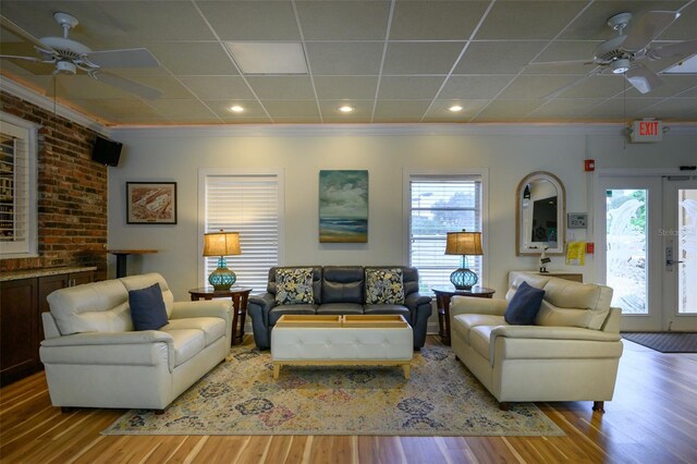 1350 N Portofino Dr Unit 208, Sarasota, FL 34242 - living room with ceiling fan, plenty of natural light, crown molding, and wood finished floors