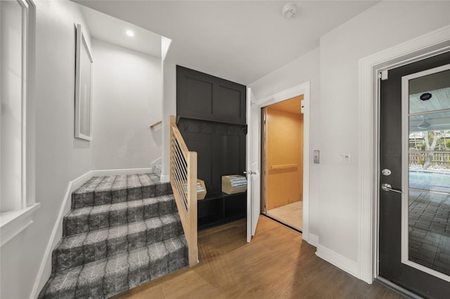 120 White Ave, Anna Maria, FL 34216 - stairway featuring wood finished floors and baseboards