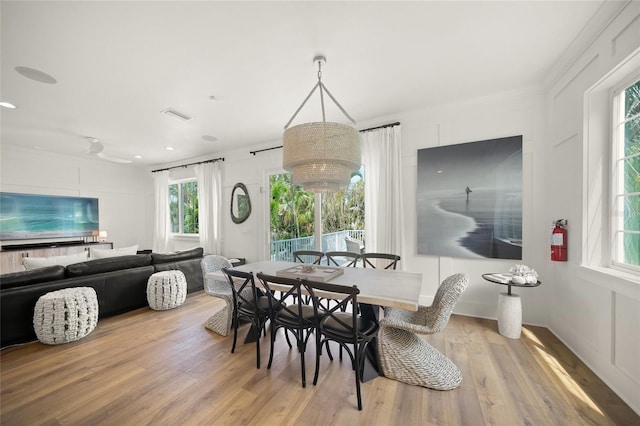 120 White Ave, Anna Maria, FL 34216 - dining room with light wood finished floors and recessed lighting