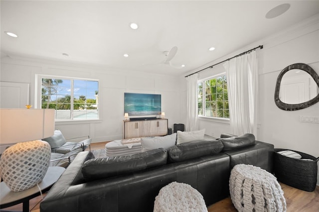 120 White Ave, Anna Maria, FL 34216 - living room with wood finished floors, crown molding, and recessed lighting