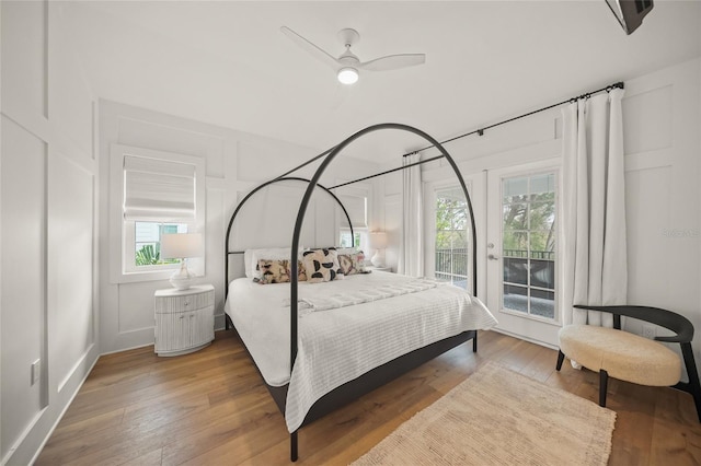 120 White Ave, Anna Maria, FL 34216 - bedroom with access to outside, hardwood / wood-style flooring, and ceiling fan