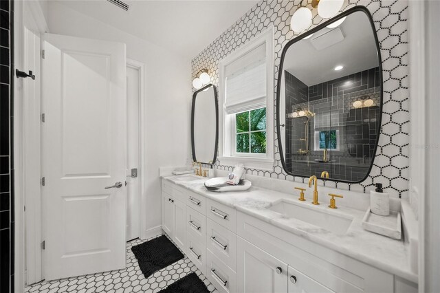 120 White Ave, Anna Maria, FL 34216 - full bathroom with a stall shower, double vanity, and baseboards