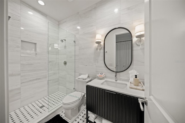 120 White Ave, Anna Maria, FL 34216 - bathroom featuring a shower stall, tile walls, vanity, and toilet