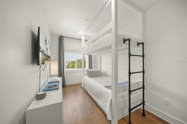 120 White Ave, Anna Maria, FL 34216 - bedroom with wood-type flooring, baseboards, and recessed lighting