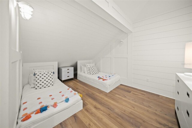 120 White Ave, Anna Maria, FL 34216 - bedroom featuring lofted ceiling and light wood-style floors