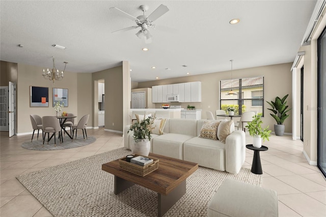 8118 Stirling Falls Cir, Sarasota, FL 34243 - living area with a chandelier, light tile patterned flooring, ceiling fan, and recessed lighting