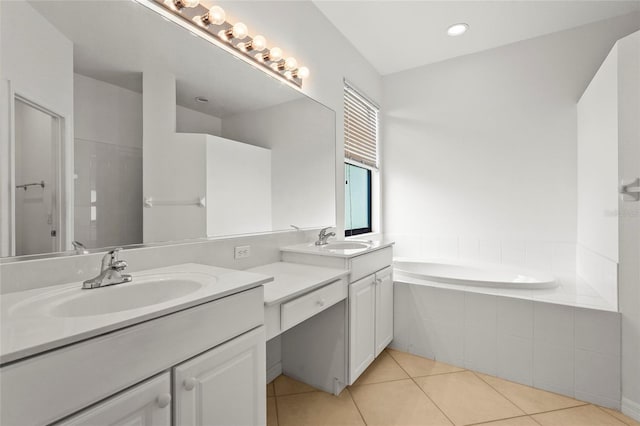 8118 Stirling Falls Cir, Sarasota, FL 34243 - bathroom featuring double vanity, tile patterned floors, and a bath