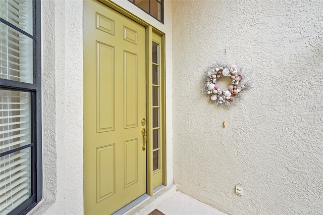8118 Stirling Falls Cir, Sarasota, FL 34243 - doorway to property featuring stucco siding