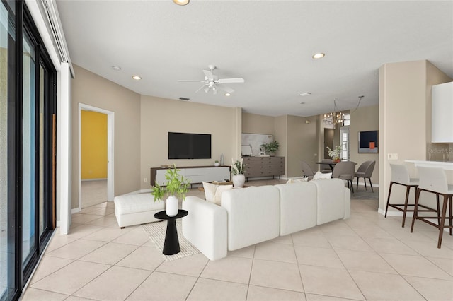 8118 Stirling Falls Cir, Sarasota, FL 34243 - living room with recessed lighting, light tile patterned floors, and ceiling fan