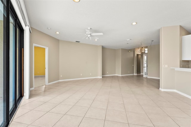 8118 Stirling Falls Cir, Sarasota, FL 34243 - empty room featuring recessed lighting, a ceiling fan, a chandelier, and light tile patterned floors