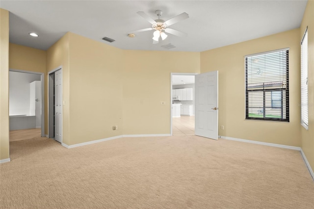 8118 Stirling Falls Cir, Sarasota, FL 34243 - unfurnished bedroom with light colored carpet, ceiling fan, and recessed lighting