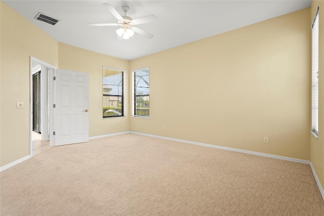 8118 Stirling Falls Cir, Sarasota, FL 34243 - spare room featuring light colored carpet and ceiling fan