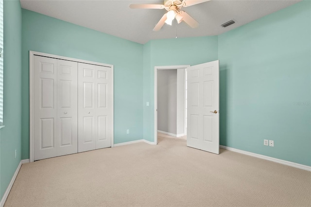 8118 Stirling Falls Cir, Sarasota, FL 34243 - unfurnished bedroom featuring carpet, a closet, and ceiling fan