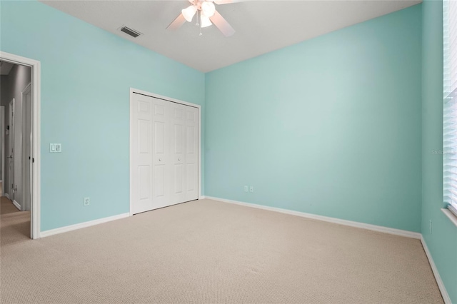 8118 Stirling Falls Cir, Sarasota, FL 34243 - unfurnished bedroom featuring carpet floors, a closet, and a ceiling fan