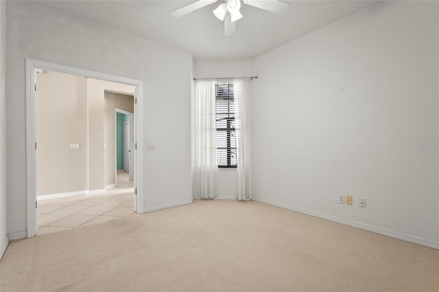 8118 Stirling Falls Cir, Sarasota, FL 34243 - spare room featuring carpet, a ceiling fan, and tile patterned floors