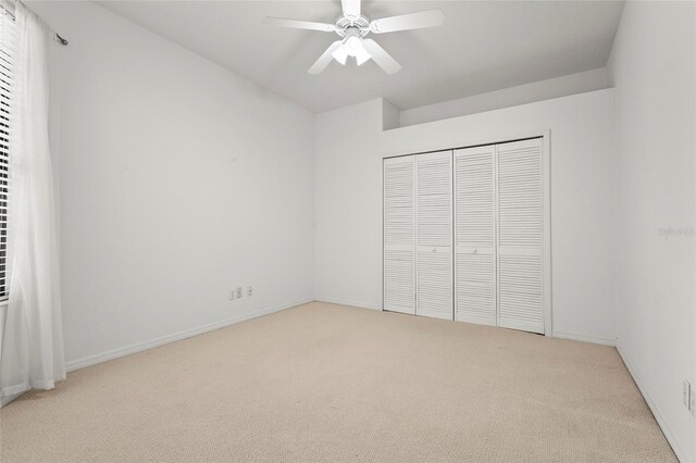 8118 Stirling Falls Cir, Sarasota, FL 34243 - unfurnished bedroom featuring carpet, a closet, and ceiling fan