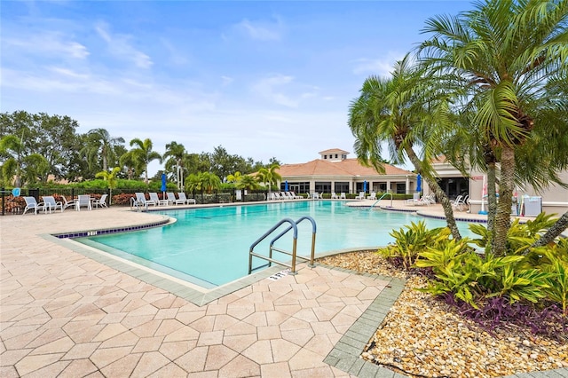 8118 Stirling Falls Cir, Sarasota, FL 34243 - community pool featuring a patio