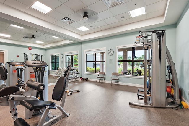8118 Stirling Falls Cir, Sarasota, FL 34243 - exercise room featuring a paneled ceiling and a raised ceiling