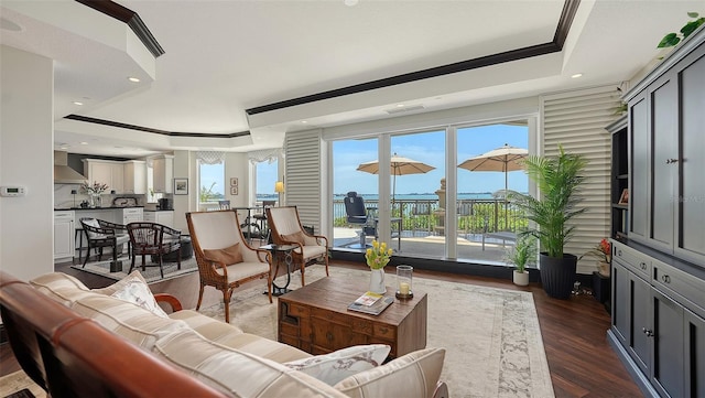 420 Golden Gate Pt Unit 200A, Sarasota, FL 34236 - living room featuring a tray ceiling, dark wood-style floors, crown molding, and recessed lighting