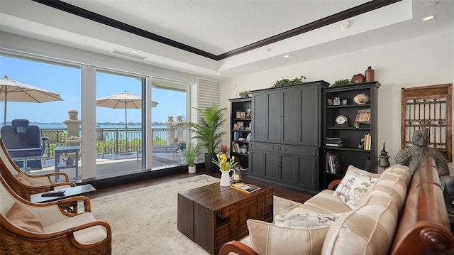 420 Golden Gate Pt Unit 200A, Sarasota, FL 34236 - living area with crown molding, wood finished floors, and recessed lighting