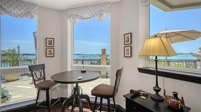 420 Golden Gate Pt Unit 200A, Sarasota, FL 34236 - dining room featuring a water view