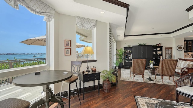 420 Golden Gate Pt Unit 200A, Sarasota, FL 34236 - dining room featuring wood finished floors, a raised ceiling, and recessed lighting