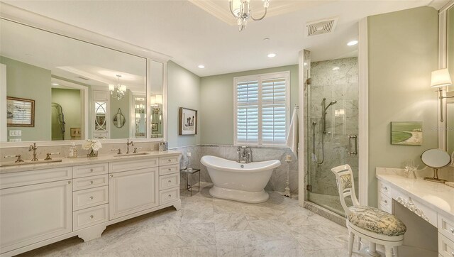 420 Golden Gate Pt Unit 200A, Sarasota, FL 34236 - bathroom with a tray ceiling, a stall shower, a chandelier, a soaking tub, and double vanity