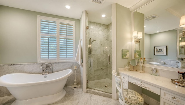 420 Golden Gate Pt Unit 200A, Sarasota, FL 34236 - full bath with a shower stall, a freestanding bath, marble finish flooring, recessed lighting, and vanity