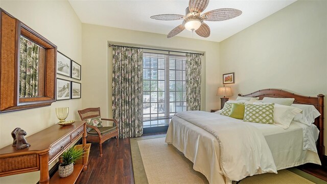 420 Golden Gate Pt Unit 200A, Sarasota, FL 34236 - bedroom with multiple windows, wood finished floors, and ceiling fan
