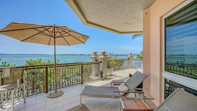 420 Golden Gate Pt Unit 200A, Sarasota, FL 34236 - balcony featuring a water view