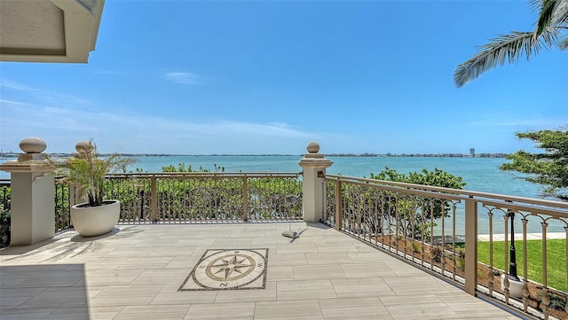 420 Golden Gate Pt Unit 200A, Sarasota, FL 34236 - view of patio with a water view and a balcony