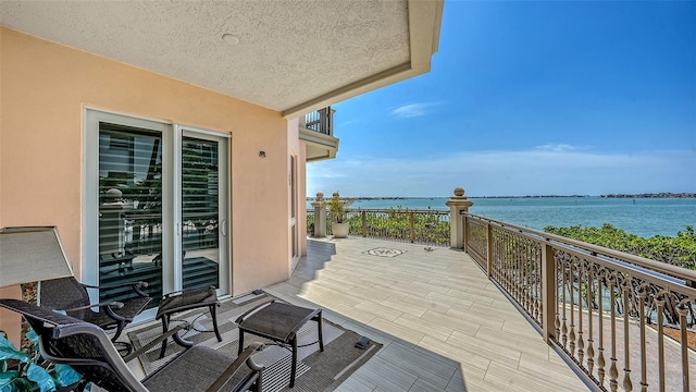 420 Golden Gate Pt Unit 200A, Sarasota, FL 34236 - balcony featuring a water view