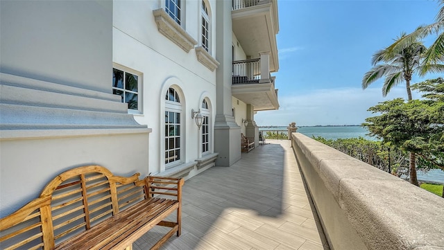 420 Golden Gate Pt Unit 200A, Sarasota, FL 34236 - wooden terrace with a water view