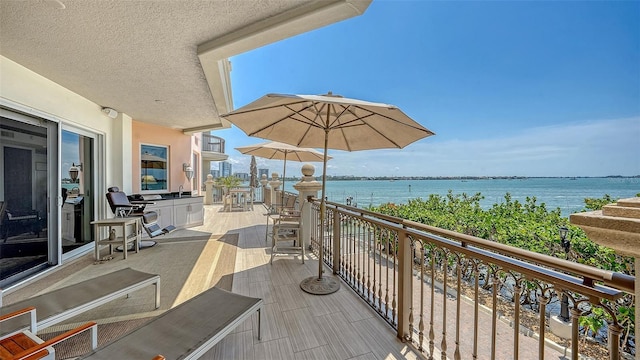 420 Golden Gate Pt Unit 200A, Sarasota, FL 34236 - balcony featuring a water view