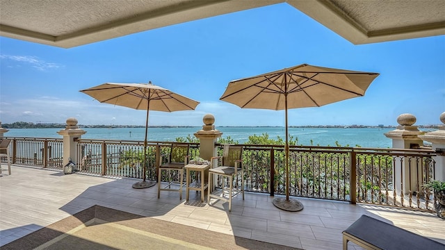 420 Golden Gate Pt Unit 200A, Sarasota, FL 34236 - view of patio / terrace with a water view and a balcony