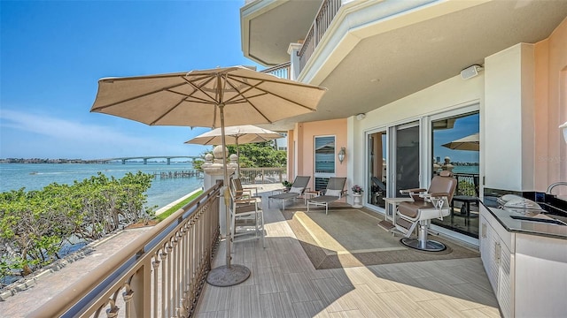 420 Golden Gate Pt Unit 200A, Sarasota, FL 34236 - wooden terrace featuring a water view