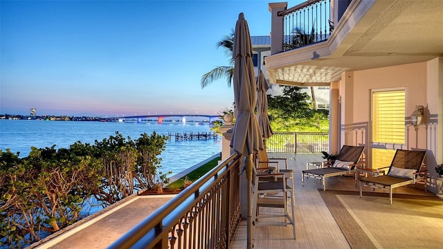 420 Golden Gate Pt Unit 200A, Sarasota, FL 34236 - balcony at dusk with a water view