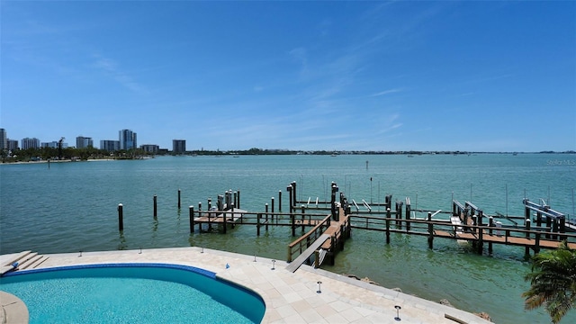 420 Golden Gate Pt Unit 200A, Sarasota, FL 34236 - dock area with a water view and an outdoor pool