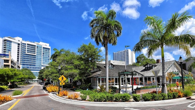 420 Golden Gate Pt Unit 200A, Sarasota, FL 34236 - view of asphalt street featuring street lights, traffic signs, and curbs