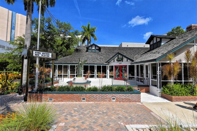 420 Golden Gate Pt Unit 200A, Sarasota, FL 34236 - rear view of house with french doors, a sunroom, and crawl space