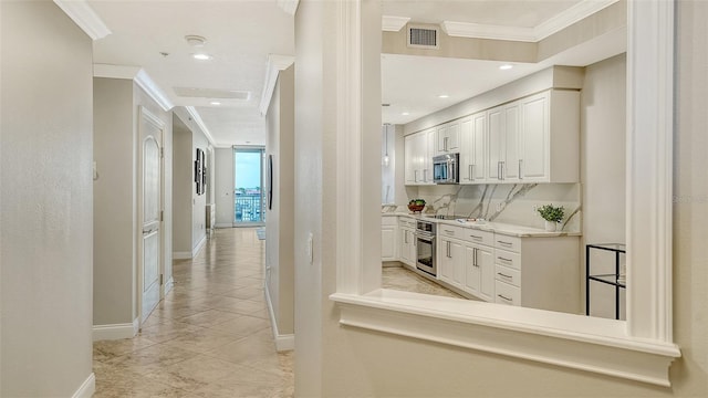 606 Riviera Dunes Way Unit 306, Palmetto, FL 34221 - hallway with crown molding, baseboards, light tile patterned flooring, and recessed lighting