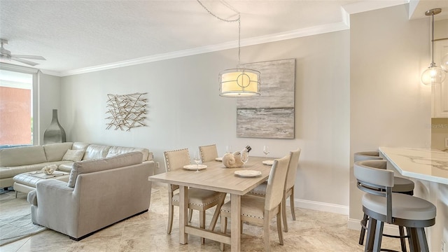 606 Riviera Dunes Way Unit 306, Palmetto, FL 34221 - dining area featuring crown molding, ceiling fan, and baseboards