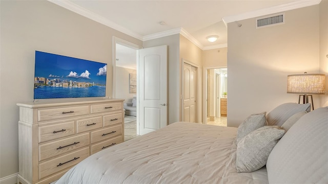 606 Riviera Dunes Way Unit 306, Palmetto, FL 34221 - bedroom featuring ornamental molding, ensuite bathroom, and baseboards