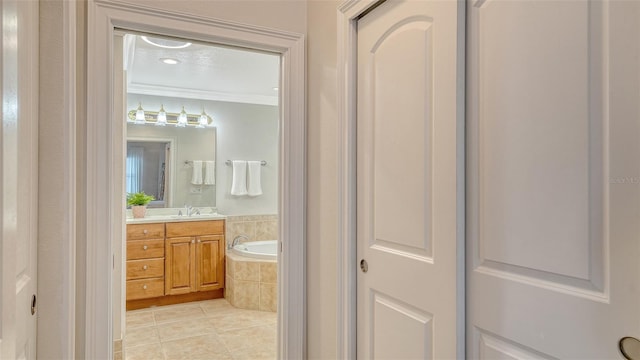 606 Riviera Dunes Way Unit 306, Palmetto, FL 34221 - full bathroom with tile patterned floors, vanity, crown molding, and a bath